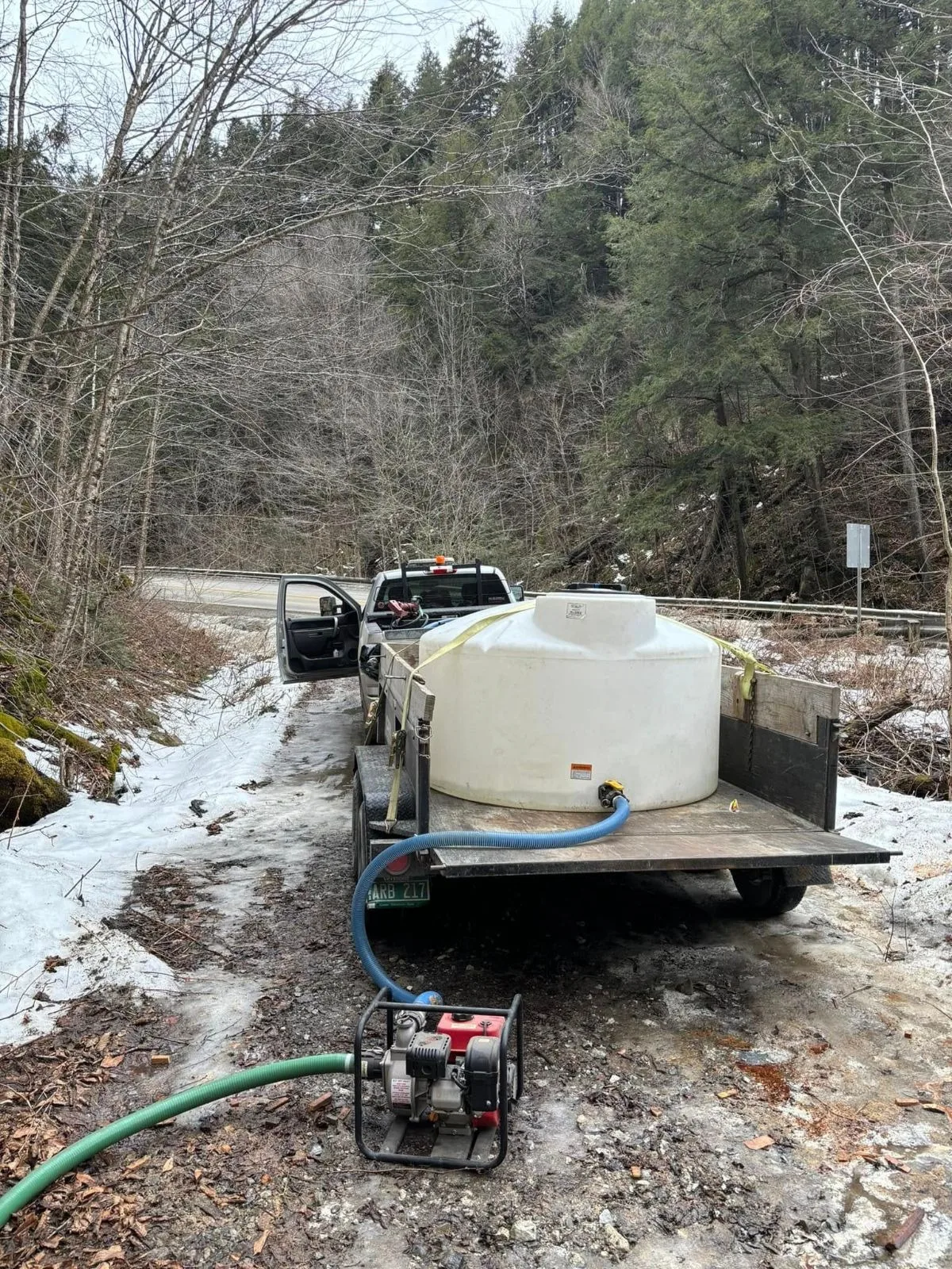 Sap collection tank in the snowy woods